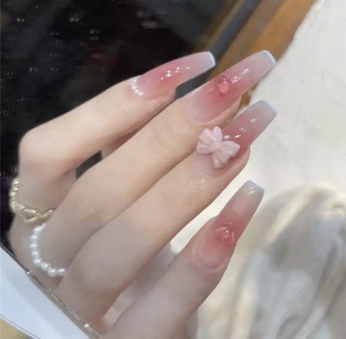Soft pink jelly nail designs with rhinestones, pink accents, cute styling — design 5