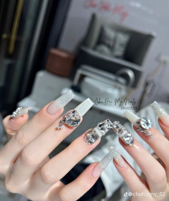 White nails with large luxurious stones