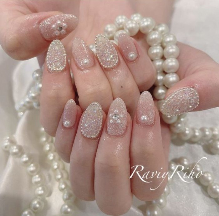 Short round pointed white nail shape with glitter beads