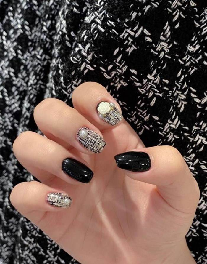Chic black nail designs with rhinestones, black accents, elegant styling — design 10