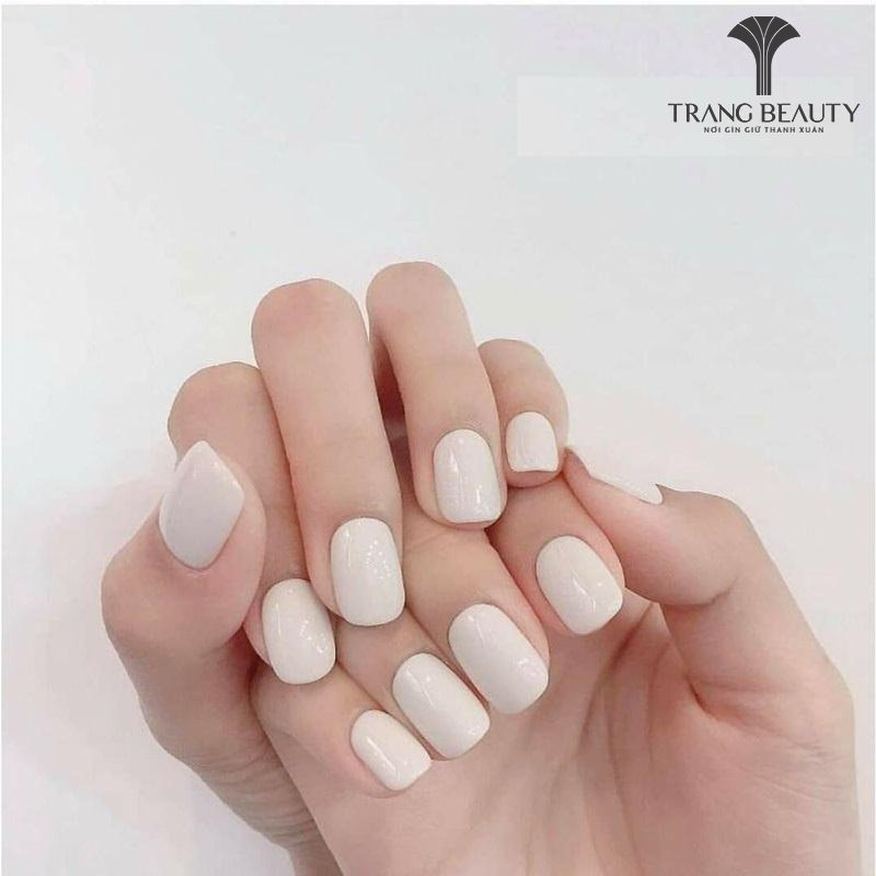 Milky tea-colored nail designs with bow charms — design 9