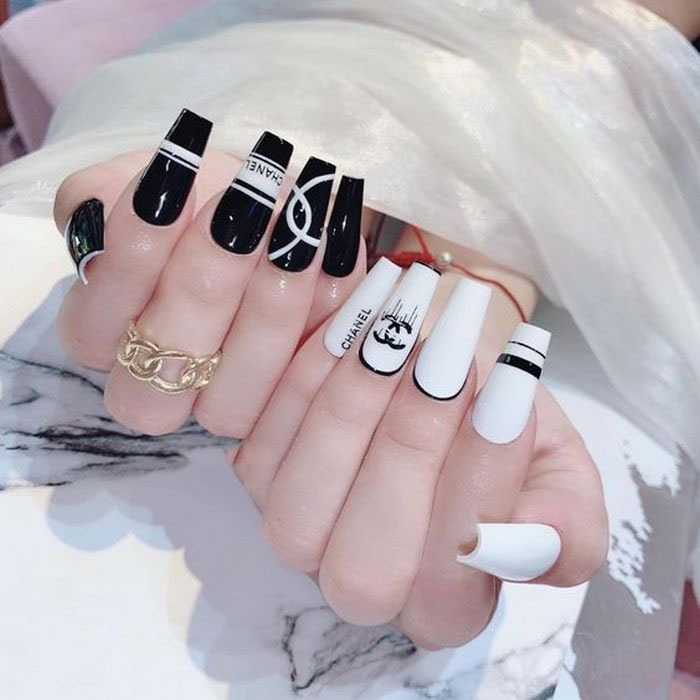 Nail polish with extremely luxurious patterns based on the Chanel name and logo