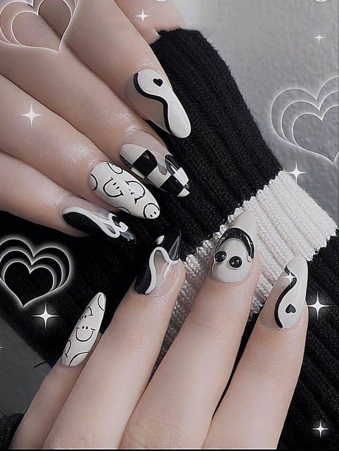 Black and white nails with many patterns for her