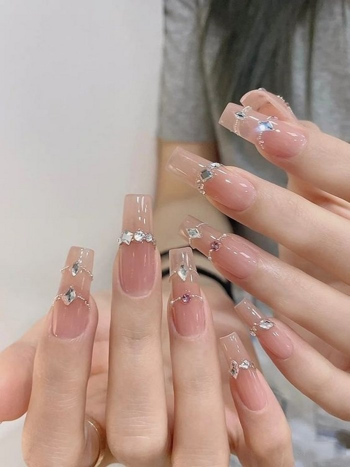 Long square nail design with sparkling charms