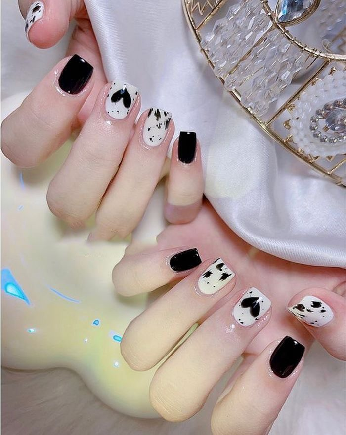 Special nail design with heart motifs and small drawings
