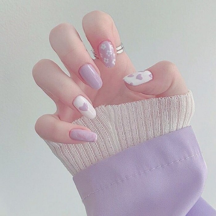 Purple and white short nail design with heart drawing