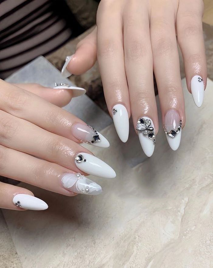 Opaque white nail designs with white tones help create the most beautiful color