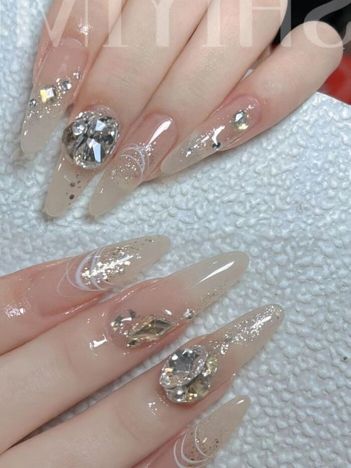Gentle bridal nail design with the most luxurious stones