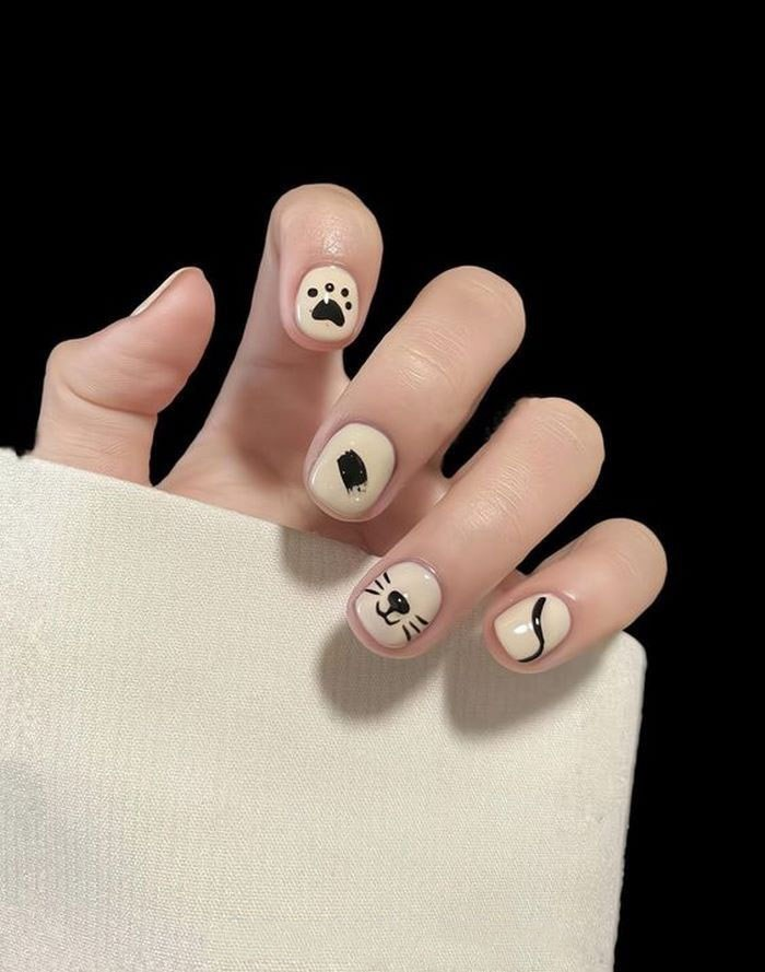 Cute short white and black nail design